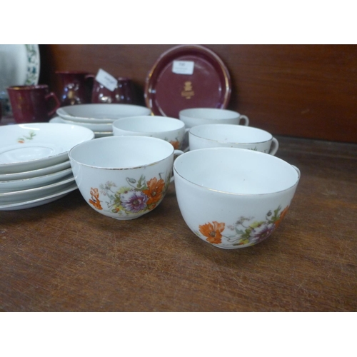 710 - Eight items of Holkham Pottery Chatsworth House commemoratives and a floral tea set