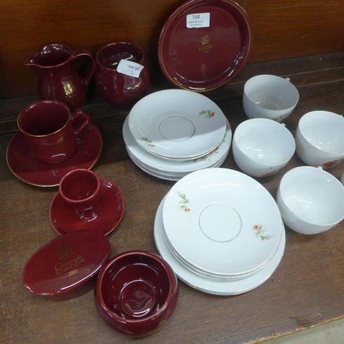 710 - Eight items of Holkham Pottery Chatsworth House commemoratives and a floral tea set