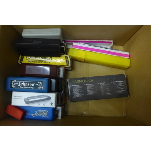 728 - A box of approximately twenty-five Chinese and Japanese harmonicas