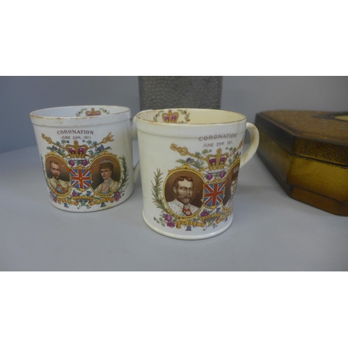 731 - A Royalty tin, two Shelley George V commemorative mugs, one a/f, a jug of Rutherford's Scotch whisky... 