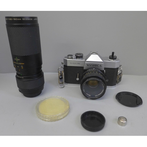 735 - A Yashica TL-Electro camera with 50mm lens and a spare 90-190mm lens