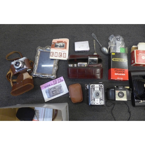 739 - A silver fronted photograph frame and assorted items including cameras