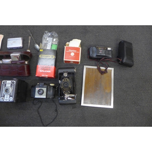 739 - A silver fronted photograph frame and assorted items including cameras