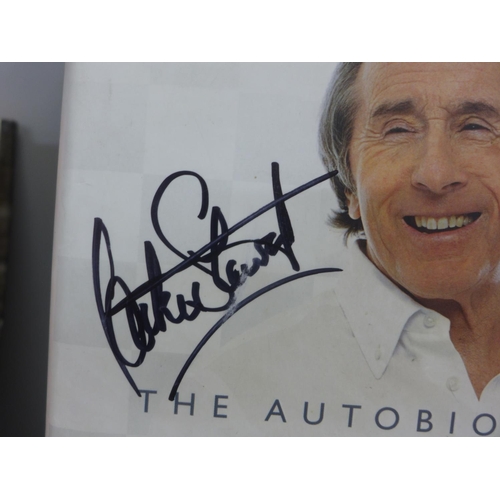 783 - A Jackie Stewart signed book and an Emlyn Hughes signed book