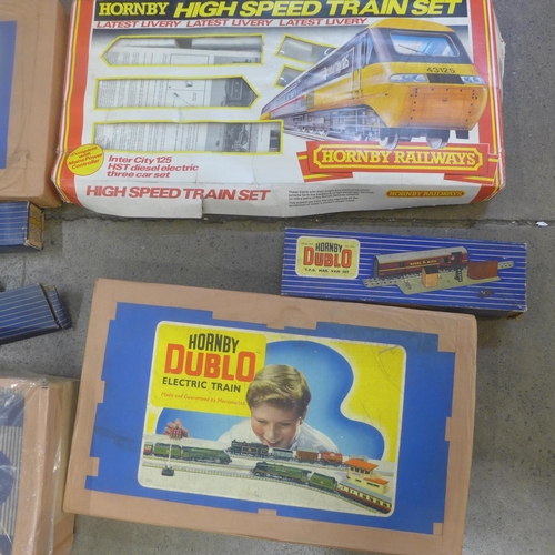 801 - Two Hornby Dublo train sets, a boxed carriage, various tracks, transformer, etc.