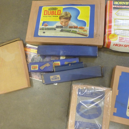 801 - Two Hornby Dublo train sets, a boxed carriage, various tracks, transformer, etc.