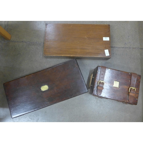 806 - Two wooden pistol cases and another wooden box with leather straps