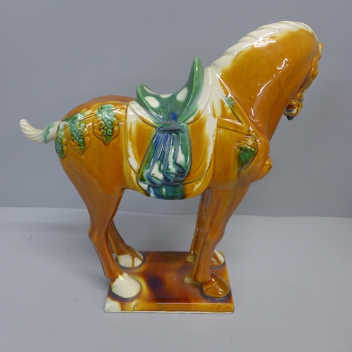 831 - A Chinese majolica figure of a horse