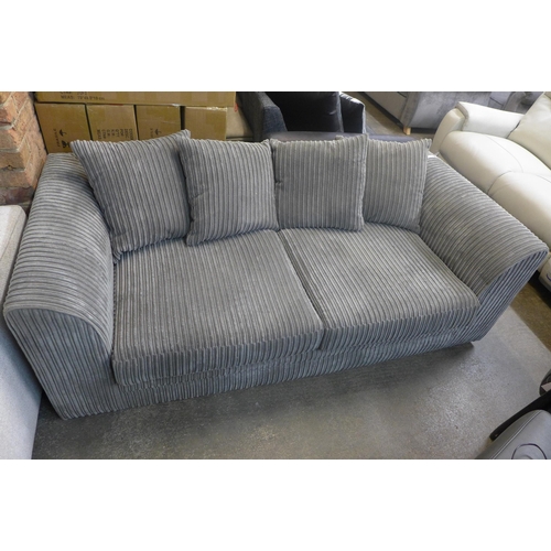 1592 - A pair of grey jumbo cord three seater sofas