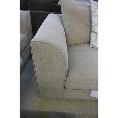 1595 - A sandstone upholstered patterned scatter back two seater sofa with footstool