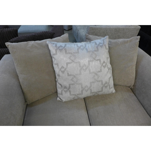 1595 - A sandstone upholstered patterned scatter back two seater sofa with footstool