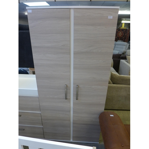 1613 - A white and wood effect freestanding wardrobe and three drawer chest * this lot is subject to VAT