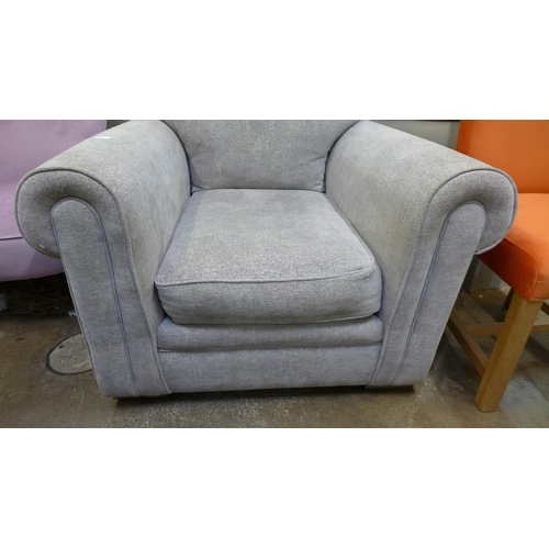 1584 - A grey fabric upholstered armchair