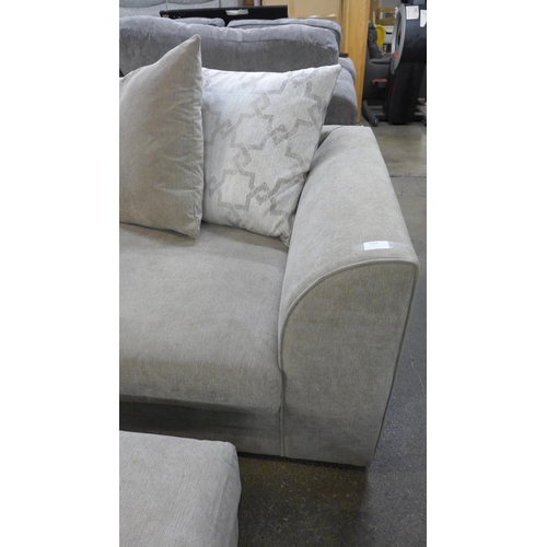 1568 - A sandstone upholstered three seater sofa with patterned scatter cushions