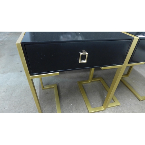 1380 - A pair of black bedside tables