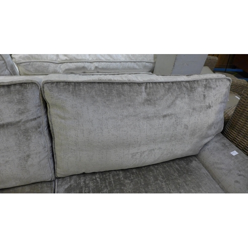 1449 - A mink velvet three seater sofa on chrome castors