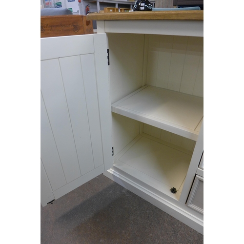 1457 - A cream painted and pine top single door, three drawer small sideboard * this lot is subject to VAT