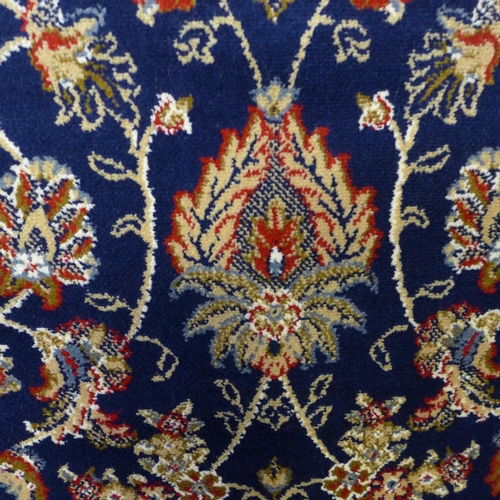 1509 - A blue ground cashmere rug with all over floral design 170 x 120