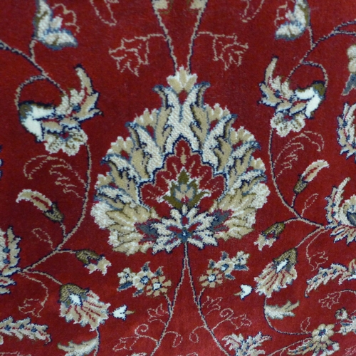 1510 - A rich red full pile Cashmere carpet with all over floral design 170 x 120