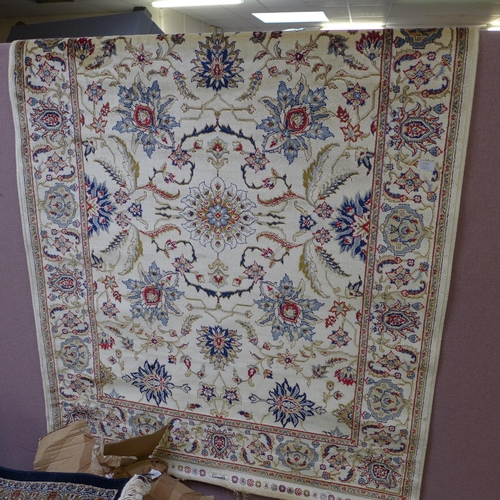 1521 - An ivory ground cashmere, full pile rug with a bespoke floral pattern 170cm x 120cm