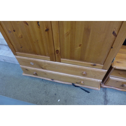 1526 - A pine two door wardrobe and bedside chest