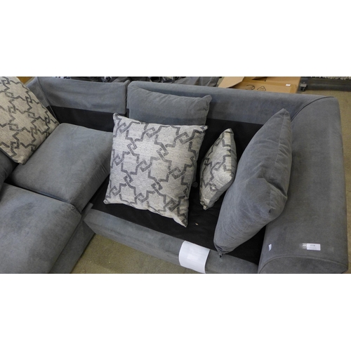 1538 - A grey and patterned corner sofa - damaged frame, missing cushions