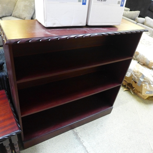 1570 - A mahogany bookcase and rope edged nest of tables