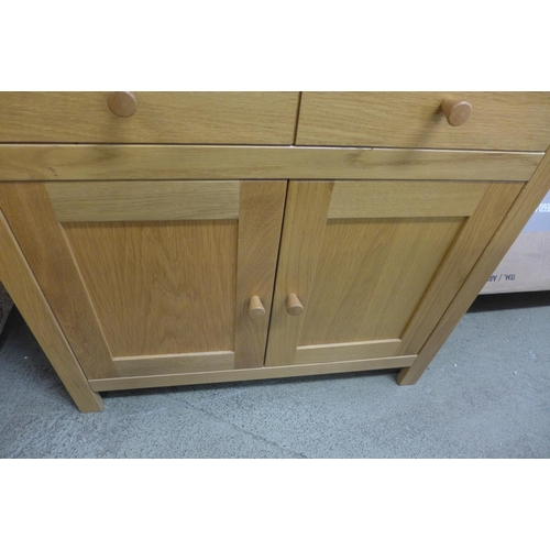 1608 - An oak two door sideboard