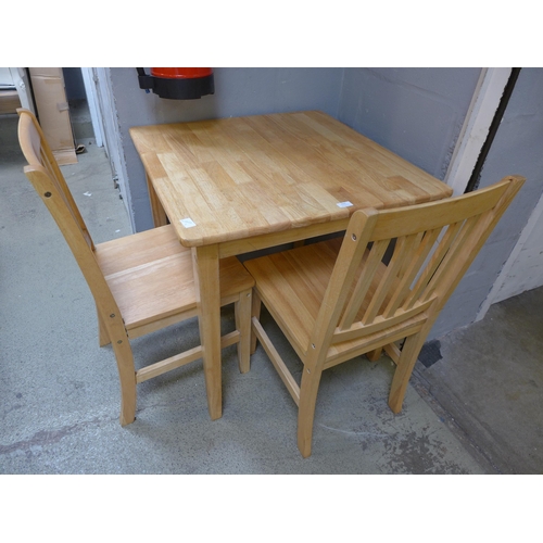 1622 - A beech kitchen table and two chairs