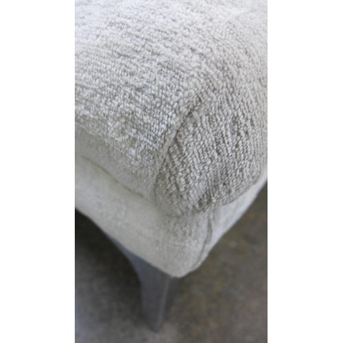 1440 - An ivory velvet buttoned footstool