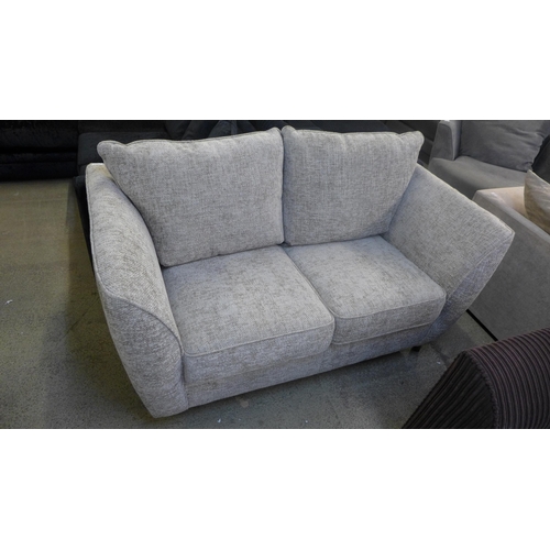 1997 - A champagne flecked textured weave two seater sofa