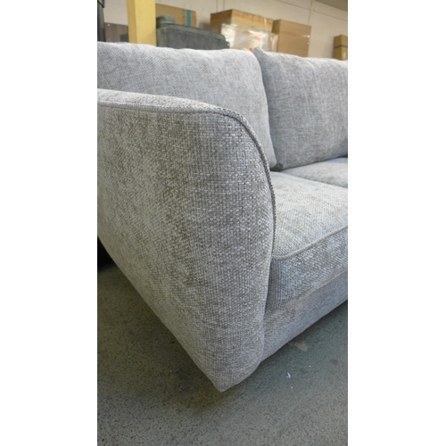 1997 - A champagne flecked textured weave two seater sofa