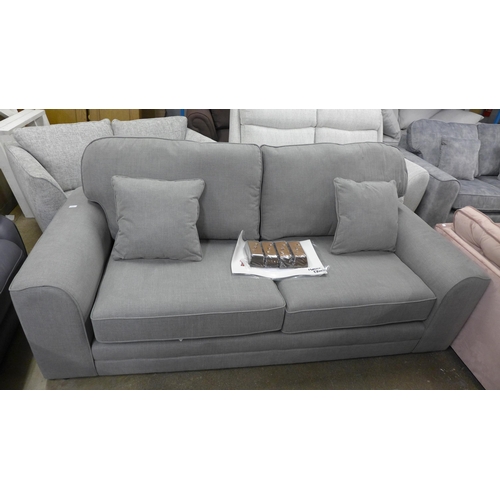 1346 - A grey fabric three seater sofa