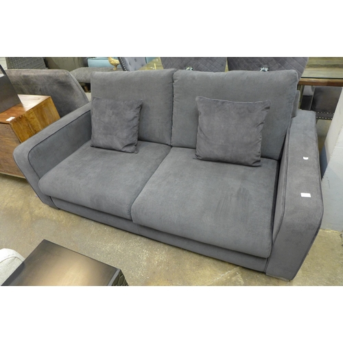 1367 - A charcoal corduroy three seater sofa