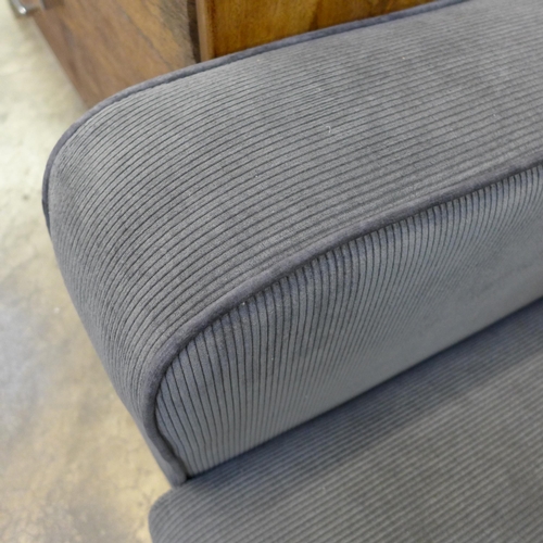 1367 - A charcoal corduroy three seater sofa