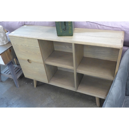 1379 - A Holcot sofa back bookcase