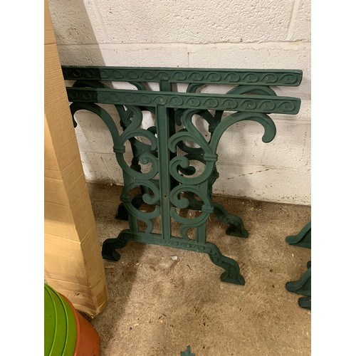 2141 - 3 sets of matching cast iron bench ends and a set of table legs with brackets