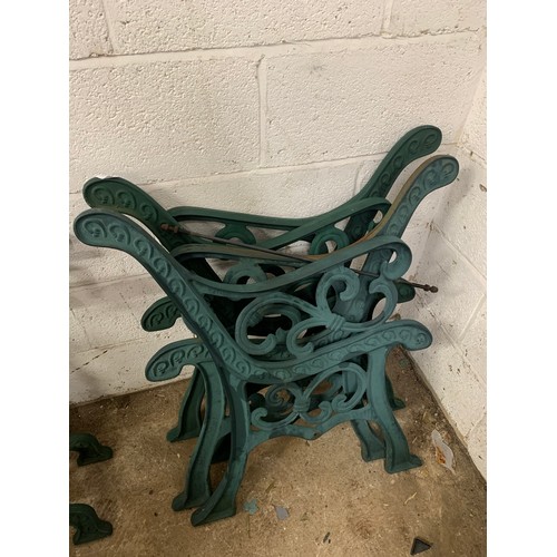 2141 - 3 sets of matching cast iron bench ends and a set of table legs with brackets