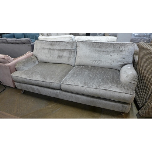 1443 - A mink velvet three seater sofa on chrome castors