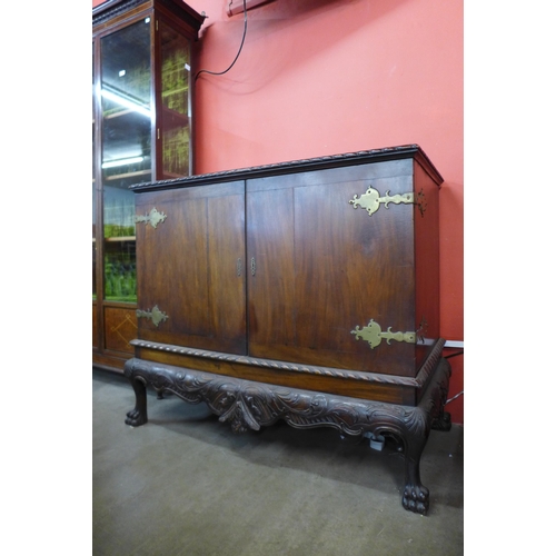 104 - An Edward VII Chippendale Revival carved mahogany press cupboard