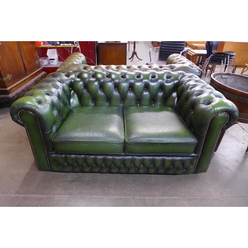 108 - A green leather Chesterfield settee