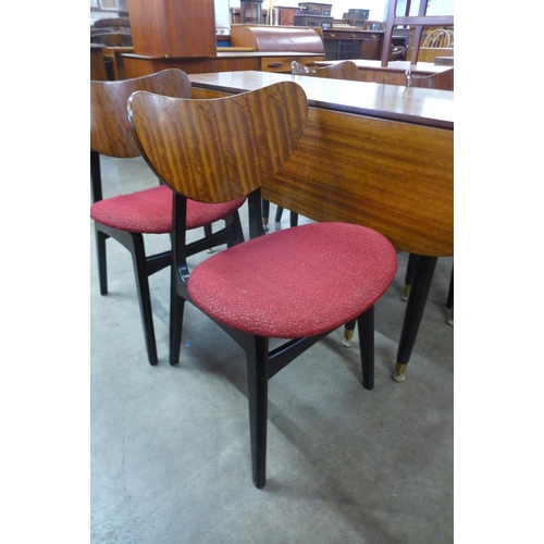 124 - A G-Plan Librenza tola wood and black drop leaf dining table and four butterfly-back chairs