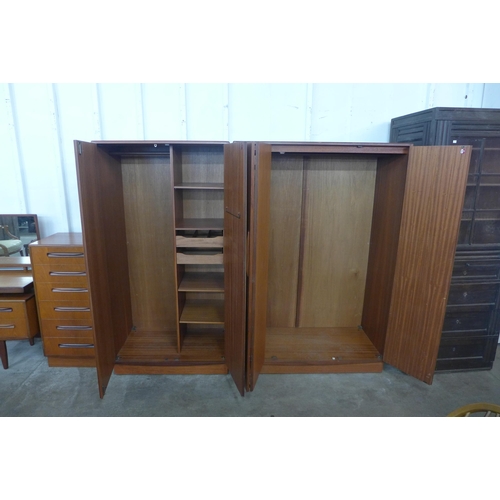 151 - A G-Plan Fresco teak four piece bedroom suite, comprising; dressing table, chest of drawers and two ... 