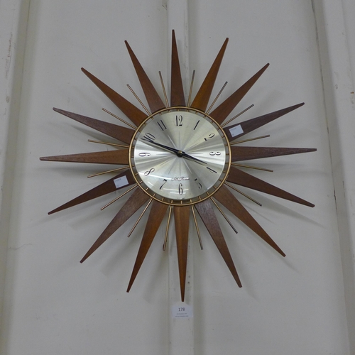 178 - A teak sunburst wall clock