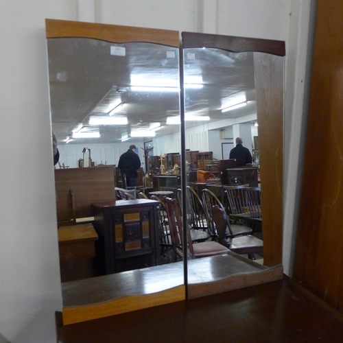 179 - A pair of teak framed mirrors