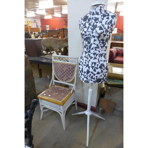 383 - A painted mannequin and a French wicker chair