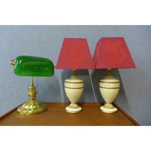 384 - A brass student's desk lamp and a pair of cream table lamps