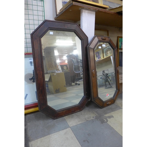 391 - Two carved oak octagonal mirrors