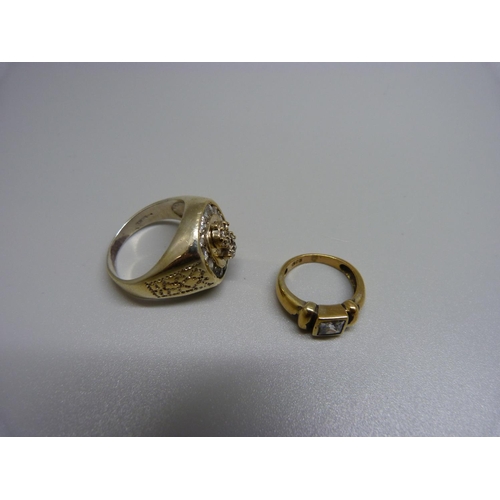 1031 - Two silver gilt rings, one lacking a stone