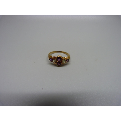 1035 - An antique amethyst and light green stone ring, one stone replaced, 2.4g, O